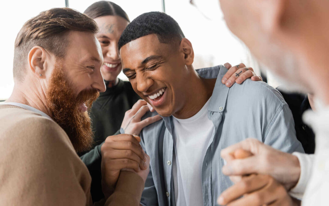 A group of male friends providing support and encouragement for men's mental health and wellness.